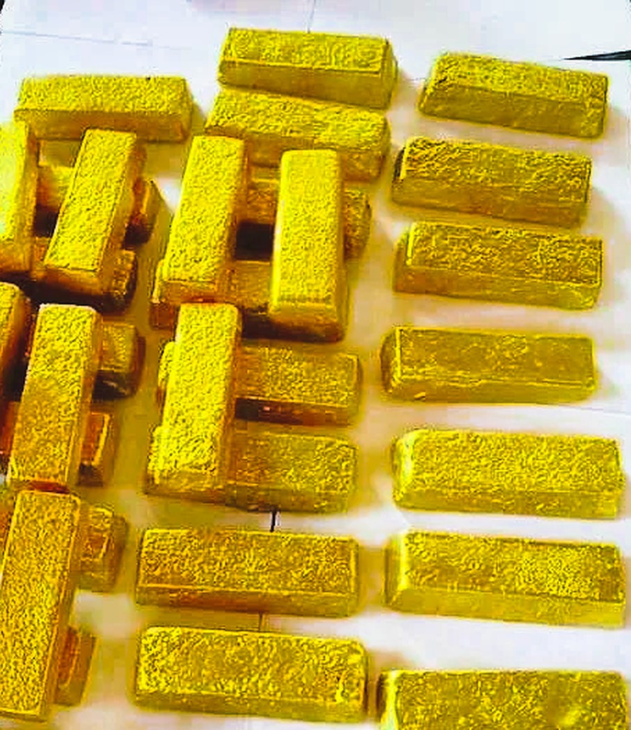 Gold dore bars in a secure refinery setting